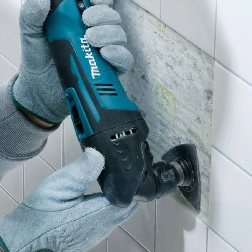 MAKITA DTM50ZX1 - Akumulatorowe urządzenie wielofunkcyjne z osprzętem